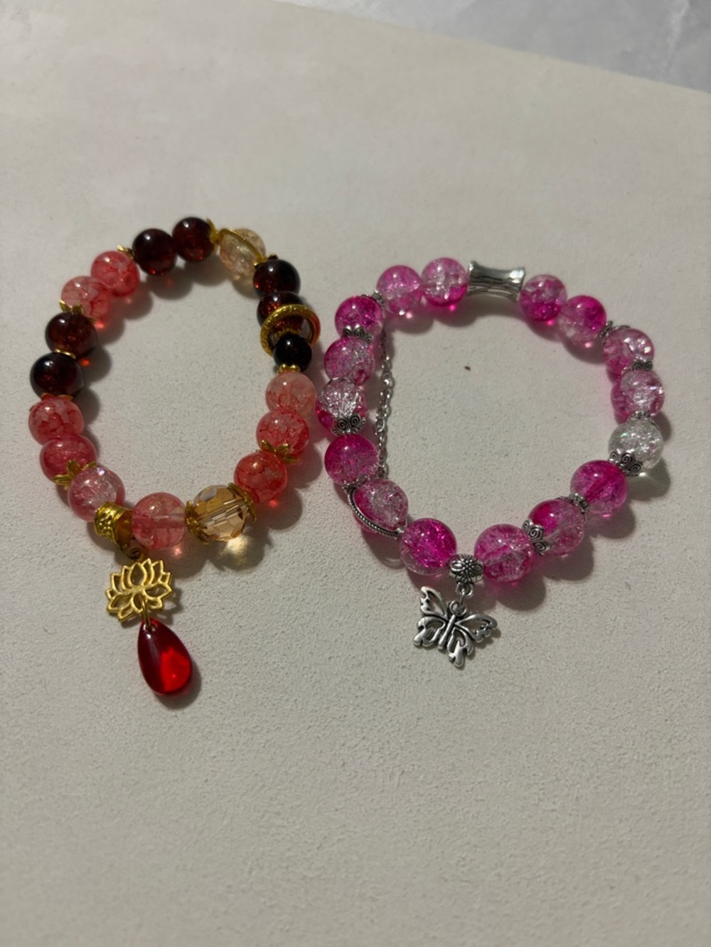 Source Unknown Pink and Red Beaded Bracelet Duo with Butterfly & Lotus Charms